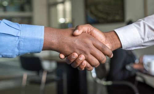 two hands clasped as a symbol of support